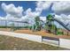 Neighborhood playground with slides, climbing structures, and shade canopy at 853 Laurel View Way, Groveland, FL 34736