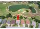 Overhead shot of property situated along golf course; community lake with manicured lawns at 9019 Se 177Th Grassmere St, The Villages, FL 32162