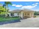 Charming clubhouse featuring lush landscaping, covered entry and well maintained exteriors at 9081 Saint Andrews Way, Mount Dora, FL 32757