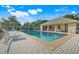 Beautiful community pool area with lounge chairs and well-maintained surroundings at 9081 Saint Andrews Way, Mount Dora, FL 32757
