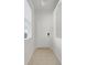 Bright entryway with tile floors leading to a door, offering a clean and welcoming space at 9081 Saint Andrews Way, Mount Dora, FL 32757