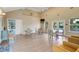 Inviting interior lounge area with tables, chairs and a view of the pool at 9081 Saint Andrews Way, Mount Dora, FL 32757