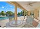 Relaxing pool patio area with comfortable seating and scenic views at 9081 Saint Andrews Way, Mount Dora, FL 32757