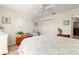 Bright bedroom with wood-look flooring, ample natural light, and closet at 9645 Se 173Rd Pl, Summerfield, FL 34491