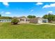 Charming single-story home with a well-manicured lawn and a cozy, inviting exterior at 9645 Se 173Rd Pl, Summerfield, FL 34491
