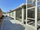 Covered lanai with screen offering backyard views and plenty of sunlight at 997 Oscar Ln, The Villages, FL 32162