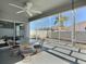 Screened patio features comfortable seating under the shade of the lanai at 997 Oscar Ln, The Villages, FL 32162