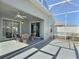 Screened patio featuring comfortable seating under the shade of the lanai at 997 Oscar Ln, The Villages, FL 32162