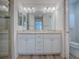 Bathroom featuring double vanity sinks, neutral countertops, and ceramic tile flooring at 1346 Kilgore Way, The Villages, FL 32163