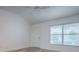 Bright bedroom with white walls, lots of natural light, and wood-look flooring at 1346 Kilgore Way, The Villages, FL 32163