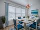 Charming dining room with elegant table setting, bright window, and stylish accents at 1346 Kilgore Way, The Villages, FL 32163