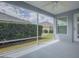 Screened lanai with view of backyard at 1346 Kilgore Way, The Villages, FL 32163