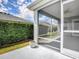 Screened lanai with view of lush backyard at 1346 Kilgore Way, The Villages, FL 32163