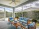 Cozy screened lanai with comfortable seating at 1346 Kilgore Way, The Villages, FL 32163