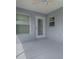 Enclosed lanai with windows and door at 1346 Kilgore Way, The Villages, FL 32163