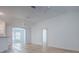 Open-concept living space with vaulted ceilings, hardwood floors, and plenty of room at 1346 Kilgore Way, The Villages, FL 32163