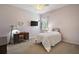 Cozy bedroom featuring carpeted floors, a ceiling fan, and a window with curtains at 10021 Lake Miona Way, Oxford, FL 34484