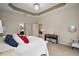 Large main bedroom featuring neutral tones, ensuite bathroom and large open space at 10021 Lake Miona Way, Oxford, FL 34484