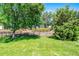 The manicured backyard features a wrought iron fence at 1047 Timbervale Trl, Clermont, FL 34715