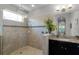 Elegant bathroom features a glass shower, vanity, and refined design, offering a serene and luxurious retreat at 1047 Timbervale Trl, Clermont, FL 34715