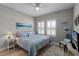 Comfortable bedroom with beachy decor and a ceiling fan for added comfort at 1047 Timbervale Trl, Clermont, FL 34715
