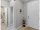Welcoming entryway with front door, hallway and bathroom entrance at 1047 Timbervale Trl, Clermont, FL 34715