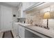 Laundry room featuring a sink, countertop, and a full-sized washer and dryer at 1047 Timbervale Trl, Clermont, FL 34715