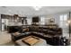 Expansive living space featuring a kitchen island, dining area, and cozy seating area; perfect for modern living at 1047 Timbervale Trl, Clermont, FL 34715