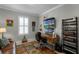 Home office featuring built-in desk, shelving, and window for natural light at 1047 Timbervale Trl, Clermont, FL 34715