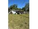 View of a single-story home with screened in porch at 10517 52Nd Ct, Belleview, FL 34420