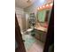 Bathroom featuring a walk in shower and wood-trimmed vanity at 10517 52Nd Ct, Belleview, FL 34420
