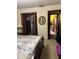 Bedroom featuring closet and doorway to another room, plus a large area rug at 10517 52Nd Ct, Belleview, FL 34420