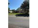 One-story house featuring solar panels and a green front yard at 10517 52Nd Ct, Belleview, FL 34420