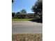 View of a single-story home featuring a well-maintained yard and solar panels on the roof at 10517 52Nd Ct, Belleview, FL 34420