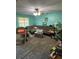 Cozy living room featuring teal walls and ceiling fan at 10517 52Nd Ct, Belleview, FL 34420
