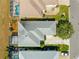 Aerial of the home showing the roof, driveway, and proximity to neighboring properties and mature landscaping at 11780 Se 178Th St, Summerfield, FL 34491