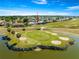 Golf course home with a lovely view of the community and well-maintained green spaces at 11780 Se 178Th St, Summerfield, FL 34491