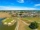 Golf course home with picturesque view of the pond and an expansive well-maintained green space at 11780 Se 178Th St, Summerfield, FL 34491