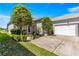 Well-maintained home featuring a two-car garage, landscaped front yard, and inviting curb appeal at 11780 Se 178Th St, Summerfield, FL 34491