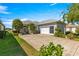 Charming home features well-manicured landscaping, a spacious driveway, and an attached two car garage at 11780 Se 178Th St, Summerfield, FL 34491