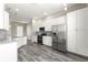 Modern kitchen boasts stainless steel appliances, granite countertops, and ample white cabinetry at 11780 Se 178Th St, Summerfield, FL 34491