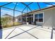 The expansive screened lanai offers views of the lush greenery and golf course at 11780 Se 178Th St, Summerfield, FL 34491