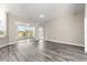 Bright living area features sliding glass doors to the lanai and neutral paint throughout at 11780 Se 178Th St, Summerfield, FL 34491