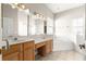 Bright main bathroom featuring double vanity, soaking tub and walk-in shower at 11780 Se 178Th St, Summerfield, FL 34491