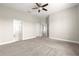 Spacious main bedroom featuring neutral carpet and multiple entry points at 11780 Se 178Th St, Summerfield, FL 34491