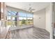 Bright sunroom with wood floors and many windows for a great view at 11780 Se 178Th St, Summerfield, FL 34491
