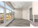 Bright sunroom featuring wood floors, large windows, and a ceiling fan at 11780 Se 178Th St, Summerfield, FL 34491