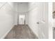 Walk-in closet featuring neutral carpeting and metal storage shelves at 11780 Se 178Th St, Summerfield, FL 34491