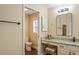 Inviting bathroom featuring a vanity with a seated make-up area at 1222 Camero Dr, The Villages, FL 32159