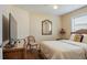 Comfortable bedroom with wicker accents and a ceiling fan at 1222 Camero Dr, The Villages, FL 32159